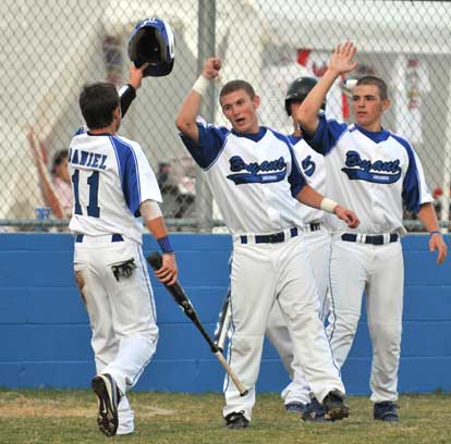 Hayden Daniel is greeted by Cameron Price and Josh Davis. (Photo by Ron Boyd)