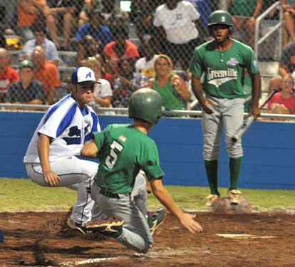 Pitcher Tryce Schalchlin, left, prepares to tag Greenville's Tyler Garrett at the plate. (Photo by Ron Boyd)