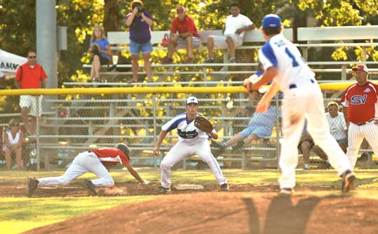 Hayden Daniel fires a pick-off throw to Tryce Schalchlin at first. (Photo by Ron Boyd)