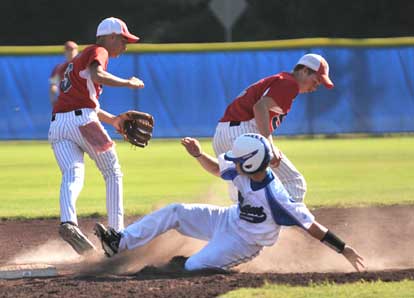 Tyler Nelson slides safely into second as Saginaw Valley middle infielders scramble for the ball. (Photo by Ron Boyd)