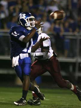 Dillon Winfrey hauls in a pass against Texarkana last season. (Photo by Rick Nation)