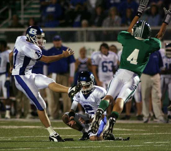 Jace Denker gets a kick away before a Van Buren player can get through to block it. (Photo by Rick Nation)