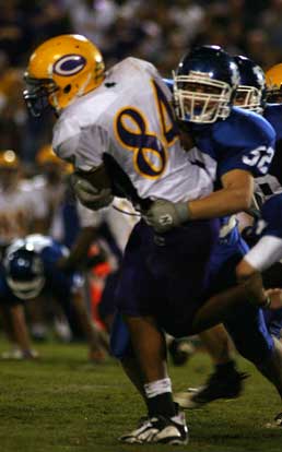 Ben Seale makes a stop against Little Rock Catholic. (Photo by Rick Nation)