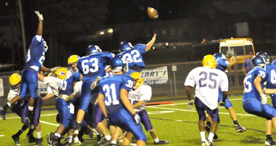 Bryant defenders Parker Dunn (32), Kaden Mills (63), Travis Royal (23),Stoney Stevens (31) and Jesse Johnson (35) try to block a Little Rock Catholic field goal attempt. (PHoto by Kevin Nagle)