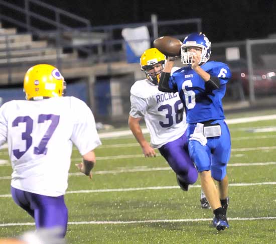 Bryant quarterback Austin Powell (6) prepares to fire. (Photo by Kevin Nagle)