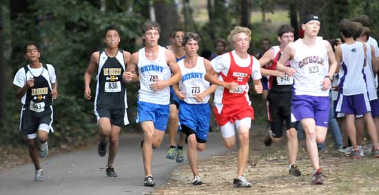 Bryant's Michael Smith and Kevin Nalley emerge from the woods with a pack of competitors during Tuesday's Bryant Invitational. (Photo by Kevin Nagle)