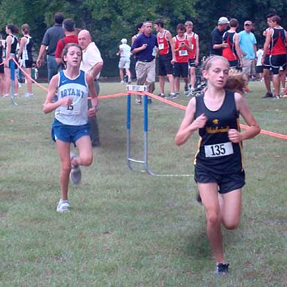 Caroline Cato, left, was the top finisher for the Bryant junior girls.