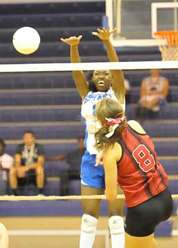 Bryant's Brianna White strains to make a block. (Photo by Kevin Nagle)