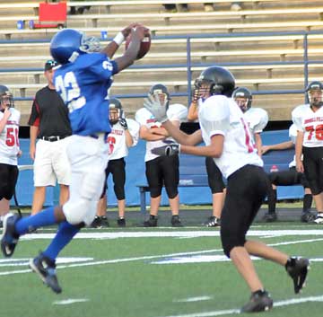 K.J. Hill plucks a pass for an interception that he returned for a touchdown. (Photo by Kevin Nagle)