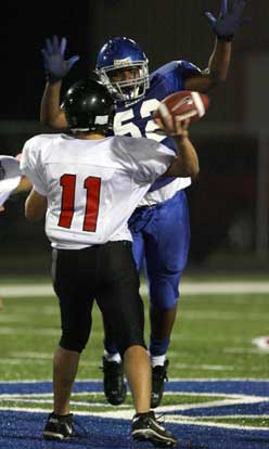 Bryant's L.J. Allen pressures Russellville quarterback Cody Jones. (Photo by Rick Nation)