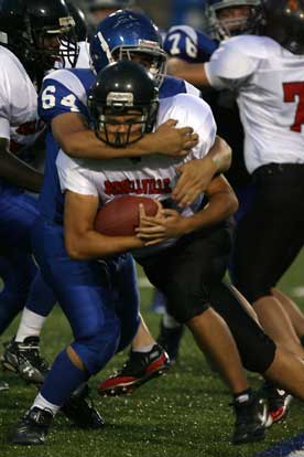 Amador Gaspar makes a tackle for Bryant. (Photo by Rick Nation)