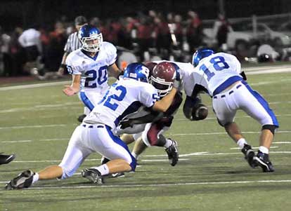 Ben Seale (52) makes a tackle as Hunter Mayall (18) forced a fumble. (Photo by Kevin Nagle)