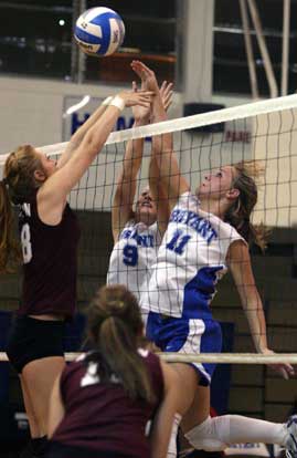 Hannah Rice and Maggie Hart battle with Benton's Kristen Ryan at net. (Photo by Rick Nation)
