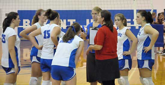 Bryant coaches Beth Solomon and Julie Long (right) talk to the Lady Hornets JV squad during a break in Tuesday's action. (Photo by Kevin Nagle)