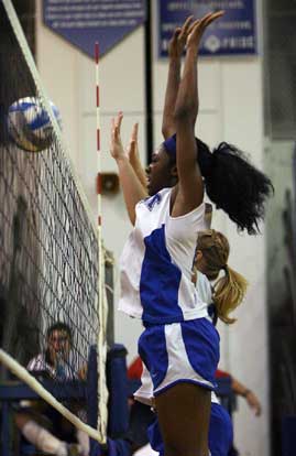 Bryant's Brianna White goes up for a block. (Photo by Rick Nation)