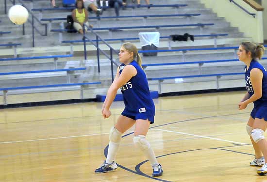 Hannah Crouch returns the ball in front of teammate Becka Shaddon. (Photo by Kevin Nagle)