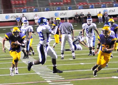 Bryant's Stephen Clark (29) hauls in a pass on his way to a touchdown. (Photo by Kevin Nagle)