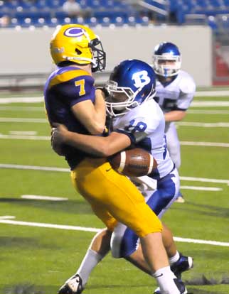 Linebacker Hunter Mayall separates Catholic's Weston Holloway from the football. (Photo by Kevin Nagle)