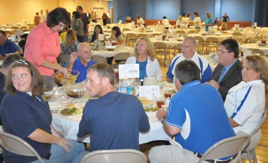 A few of the parents visit while being served. (Photo by Kevin Nagle)