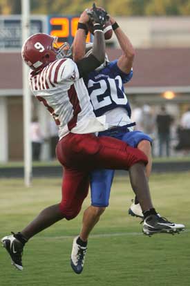 Tanner Tolbert (20) contends for a pass with a Pine Bluff receiver. (Photo by Rick Nation)