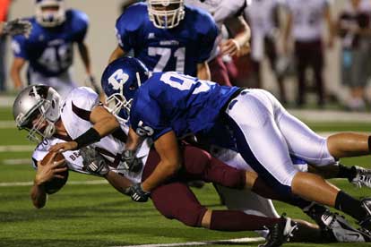 Michael Smith (95) sacks Benton's Dylan Harris. (Photo by Rick Nation)