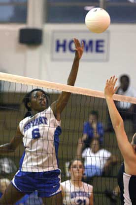 Bryant's Brianna White tips one over the net. (Photo by Rick Nation)