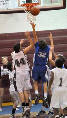 Bryant's Hunter Oglesby (32) fights for a rebound. (Photo by Kevin Nagle)