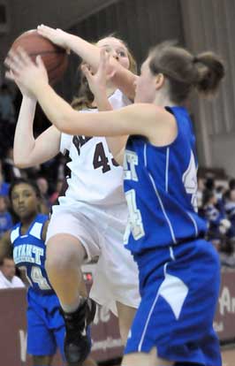 Bryant's Erica Smith (44) defends against Benton's Braylee Landreth as Destin Nichols (34) trails the play. (Photo by Kevin Nagle)