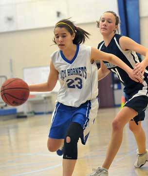 Allison Hughes drives past a Little Rock Christian defender. (Photo by Kevin Nagle)