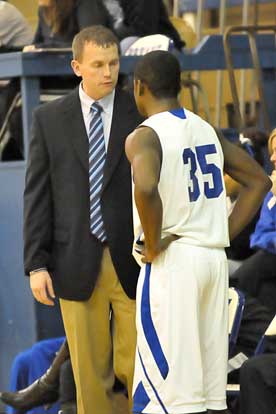 Bryant head coach Mike Abrahamson instructs Hornets' junior Eric Moore. (Photo by Kevin Nagle)