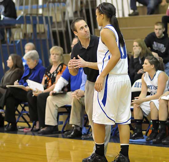 Bryant head coach Blake Condley gives instruction to junior Breanna Blundell during a break in Tuesday's action. (Photo by Kevin Nagle)