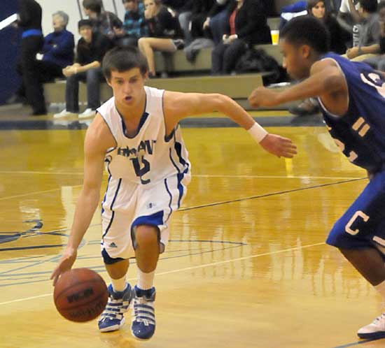 Brantley Cozart, left, tries to drive around Conway's T-Shawn Sims. (Photo by Kevin Nagle)