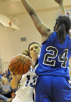 Callie Hogancamp (13) runs into a wall of defense from Bre Hobbs. (Photo by Kevin Nagle)