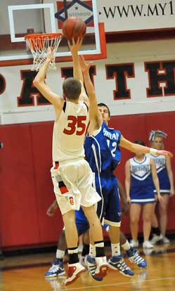 Bryant's Brantley Cozart defends a shot by Cabot's Kai Davis (35). (Photo by Kevin Nagle)