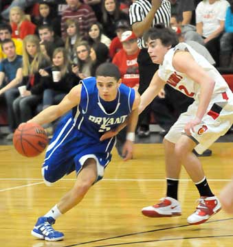 Jordan Griffin drives around Cabot's Adam Rock. (Photo by Kevin Nagle)