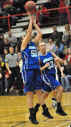 Bryant's Whitney Meyer (50) takes a shot as teammate Abbi Stearns looks to get into rebounding position. (Photo by Kevin Nagle)