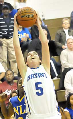 London Abernathy reaches high for a rebound. (Photo by Kevin Nagle)