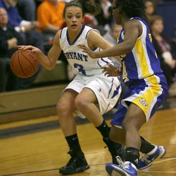 Bryant's McKenzie Adams (3) looks for room to get by North Little Rock's Kayla Brown. (Photo by Rick Nation)