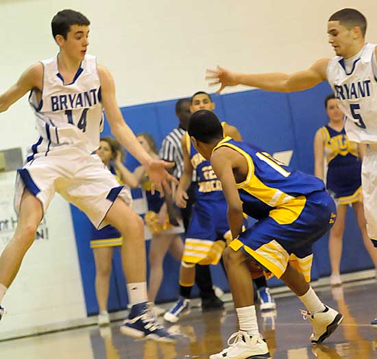 Bryant's Logan Trudell (14) and Jordan Griffin (5) try to trap North Little Rock's Gary Vines. (Photo by Kevin Nagle)