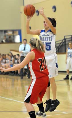 Rori Whittaker shoots over Cabot South's Molly Wood (20). (Photo by Kevin Nagle)