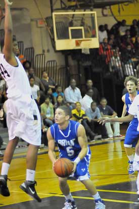 Jordan Griffin (5) pump fakes a Central defender into the air while teammate Houston Garner trails the play. (Photo by Kevin Nagle)