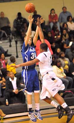 Quinton Motto shoots over a Central defender. (Photo by Kevin Nagle)