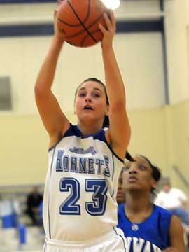 Aubree Allen collects a rebound for Bryant. (Photo by Kevin Nagle)