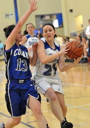 Bryant's Jessica Alliston (21) works against Conway's Hope Ison. (Photo by Kevin Nagle)