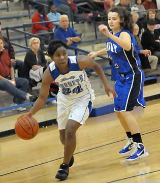 Dezerea Duckworth drives around Conway's Gabby Roark. (Photo by Kevin Nagle)