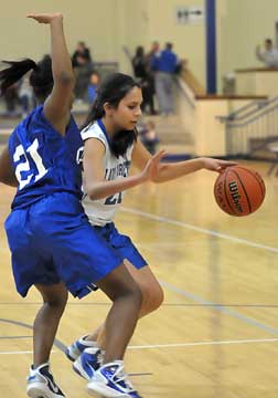 Yessinia Gaspar tries to drive around a Conway defender. (Photo by Kevin Nagle)