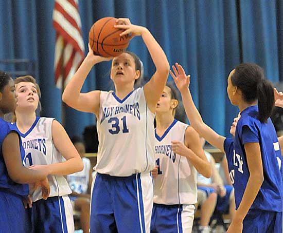 Bryant Blue's Rylee Phillips shoots in a crowd. (Photo by Kevin Nagle)