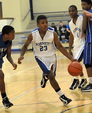 C.J. Rainey drives into the paint. (Photo by Kevin Nagle)