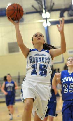 Bryant's Rori Whittaker goes up for a shot in front of Conway Blue's Sidney Mitchum (25). (Photo by Kevin Nagle)