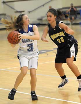 Bryant's Keedy Harrison (3) looks for an open teammate while being guarded by Pulaski Academy's Mackie Kuhn. (Photo by Kevin Nagle)